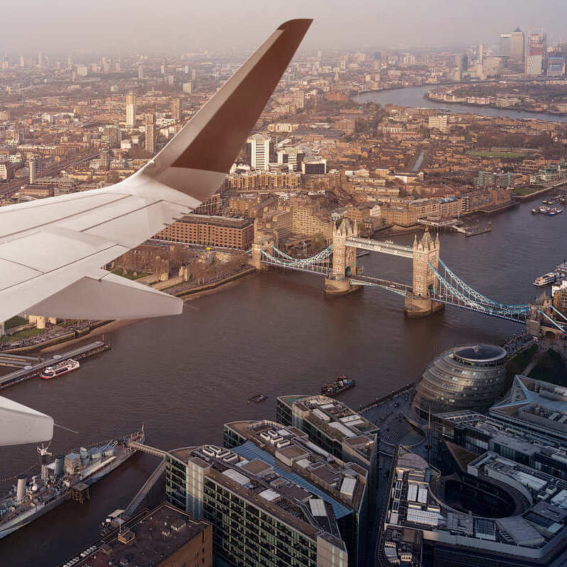Plane Wing Photographed Against The City Of London's Skyline, London Bridge, River Thames, England, United Kingdom