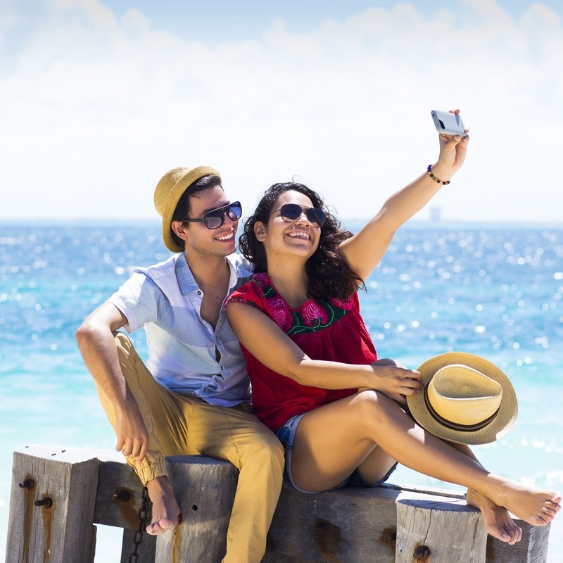 Couple Of Tourists Taking A Selfie In Cancun, Mexico