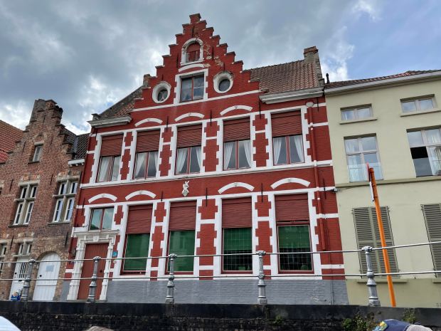 In medieval times, the blood of cows was used to color this building in Bruges, Belgium. Also note the distinctive stair-like rooftop. (Jess Fleming / Pioneer Press)