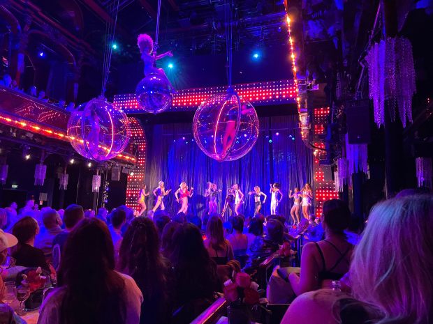 The cabaret show at Paradis Latin in Paris includes women hanging from the ceiling in transparent bubbles.